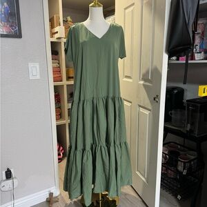 Green maxi dress with ruffled bottom and side pockets.  I have 2 for sale.  S-M.